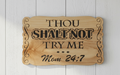 Thou Shalt Not plaque hanging on wall